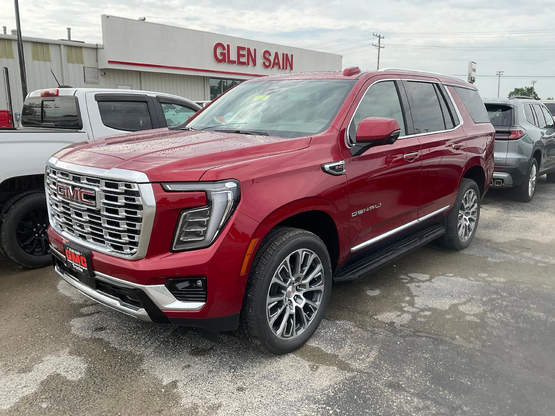 2026 GMC Yukon Denali in Volcanic Red Tintcoat — front three-quarter view