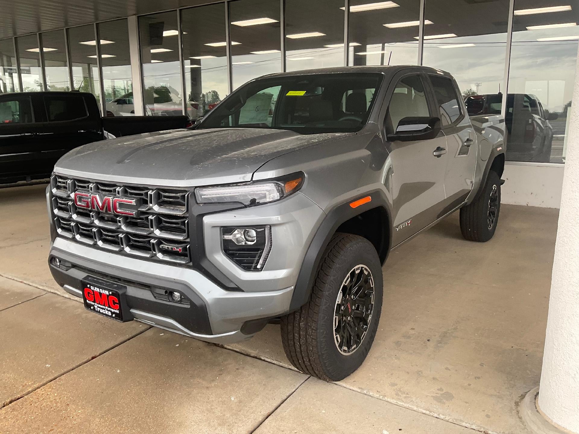 2026 GMC Canyon AT4 in Sterling Metallic — front three-quarter view