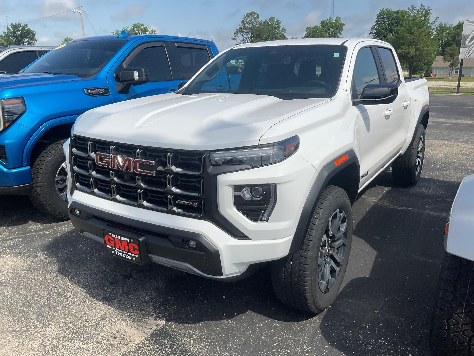 2024 GMC Canyon AT4 in Summit White — front three-quarter view