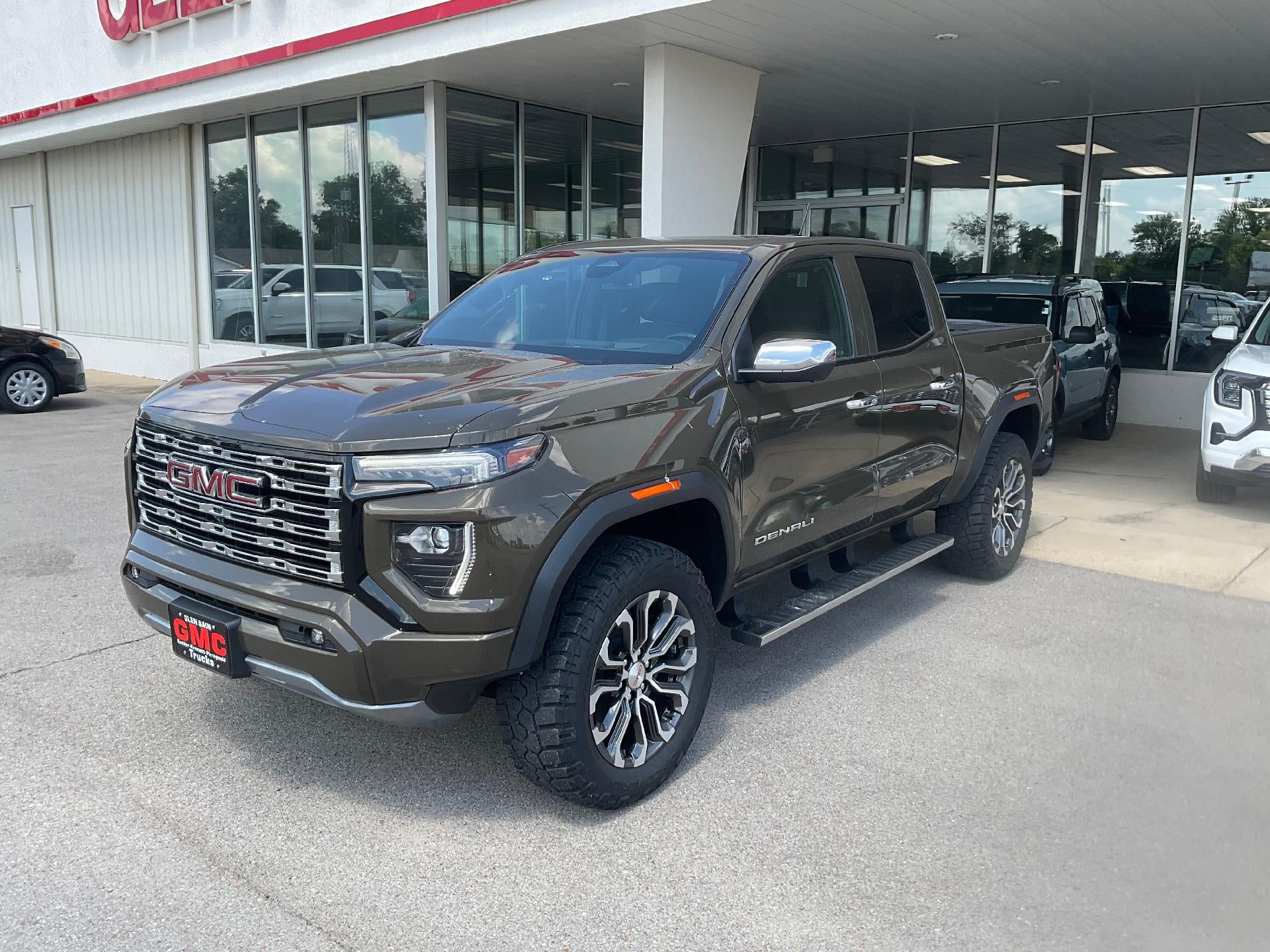 2024 GMC Canyon Denali in Deep Bronze Metallic — front three-quarter view
