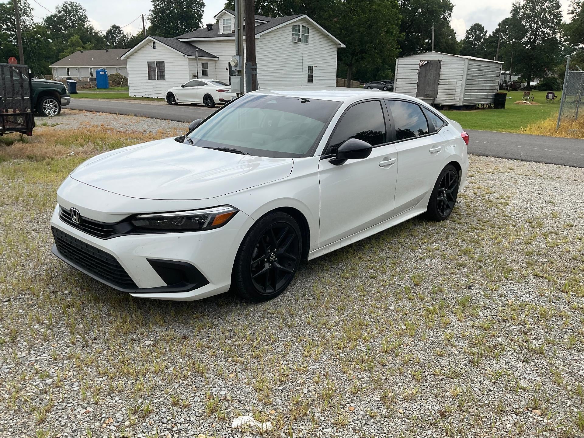 2024 Honda Civic Sedan Sport in White — front three-quarter view