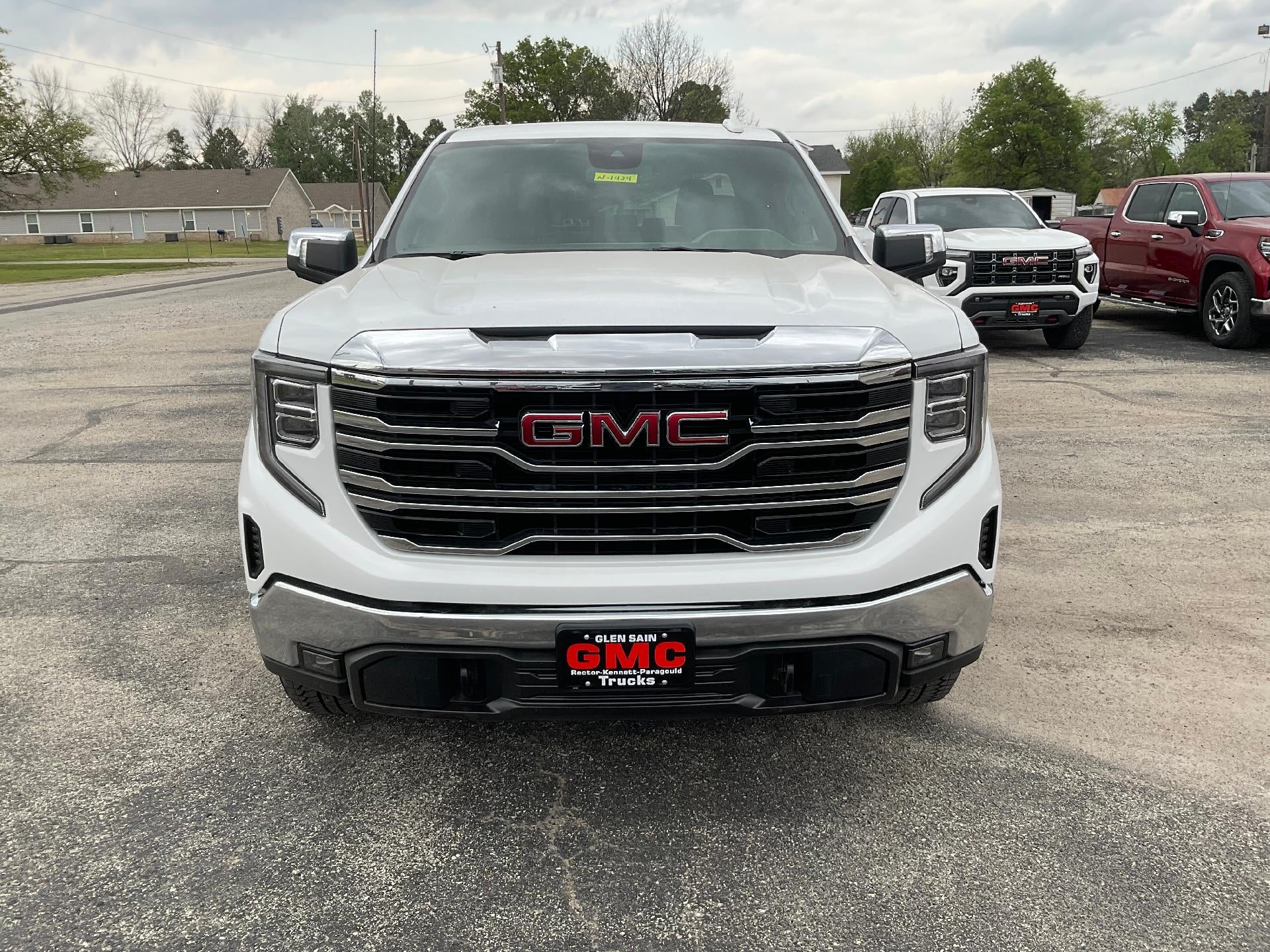 2026 GMC Sierra 1500 SLT in Summit White — front three-quarter view