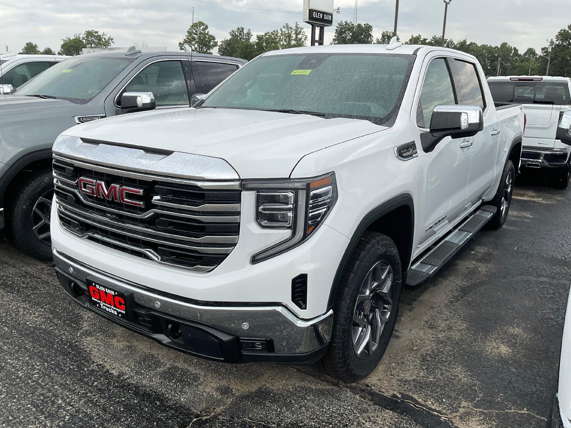 2026 GMC Sierra 1500 SLT in Summit White — front three-quarter view